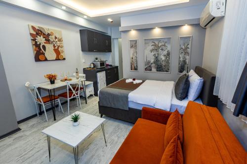 a hotel room with a bed and a couch at APOLLO HOTEL & APARTMENtS in Istanbul