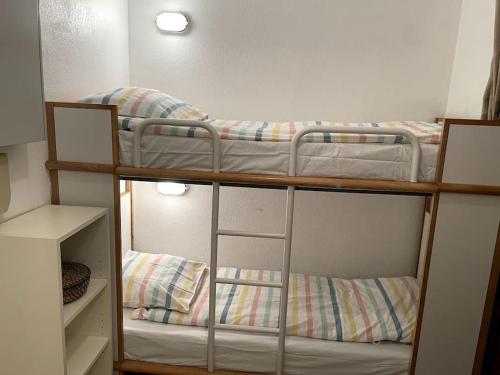 two bunk beds in a small room with at Agréable Studio Sanary-sur-mer in Sanary-sur-Mer