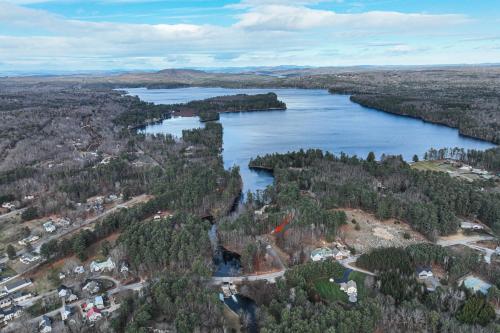 an aerial view of a river with trees and buildings at Panther Run River Retreat in Raymond