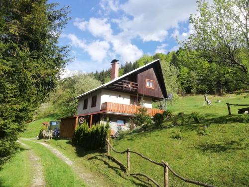 a house on top of a hill with a dirt road at Chata na Čertove in Štôla
