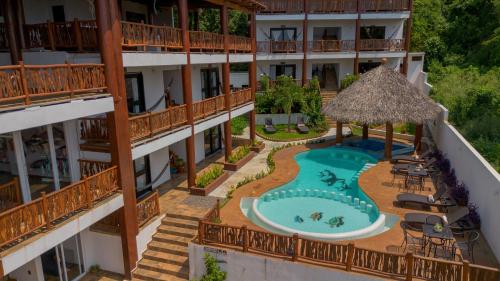 an aerial view of a hotel with a swimming pool at Hotel Alfa Troncones Mexico in Troncones