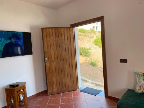 a door to a room with a sliding glass door at Awechtam house in Aouchtame