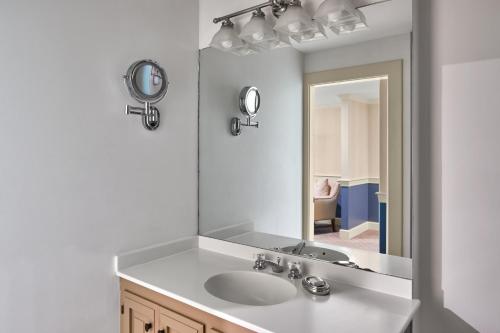 a bathroom with a sink and a mirror at Cape Arundel Inn - Club House in Kennebunkport