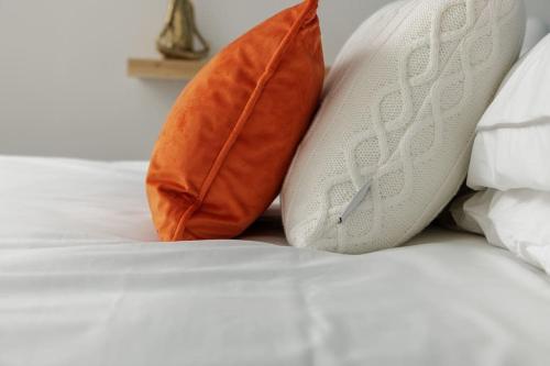 two pillows sitting on top of a bed at 82 Van Road in Caerphilly