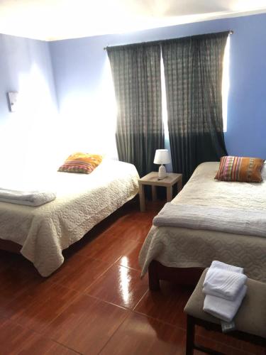 En eller flere senger på et rom på Pedraza house Airport
