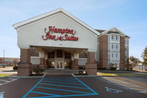 a hampton inn and suites building in a parking lot at Hampton Inn & Suites Scottsburg in Scottsburg