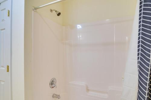 a bathroom with a shower with a glass door at The Eagles Nest at Alpine Cabin with Fireplace! in Terra Alta