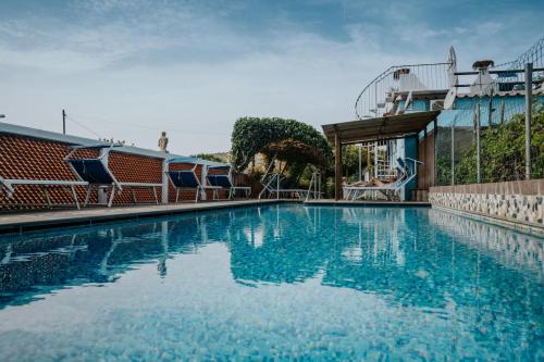 a large swimming pool on a cruise ship at Hotel Casa Giuseppina in Ischia