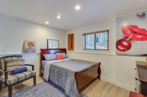 a bedroom with a bed and a chair and a window at Cozy Pennsylvania Home with Pool Table and Pool Access in Effort