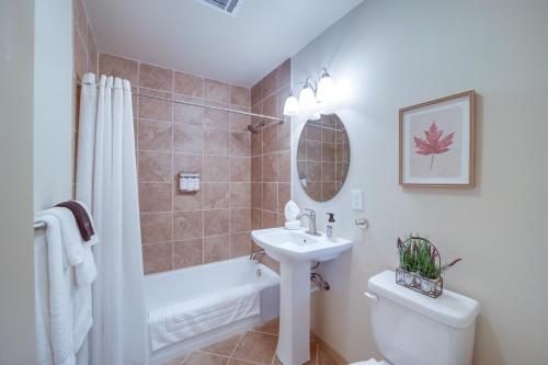 a bathroom with a sink and a toilet and a tub at Family-Friendly Sand Springs Home about 8 Mi to Tulsa! in Sand Springs