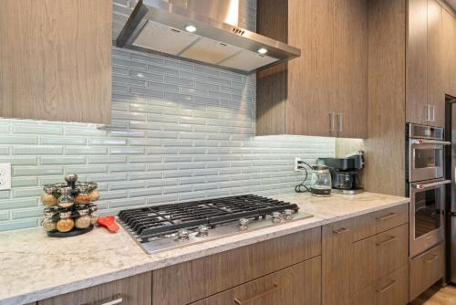 a kitchen with a stove top in a kitchen at Red Door MCA#50500 in Manzanita
