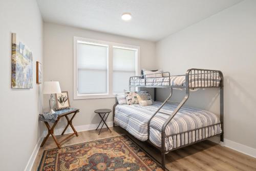 a bedroom with a bunk bed and a window at Red Door MCA#50500 in Manzanita