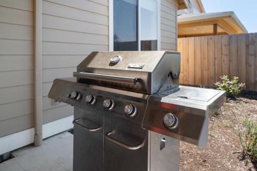 a barbecue grill sitting outside of a house at Red Door MCA#50500 in Manzanita