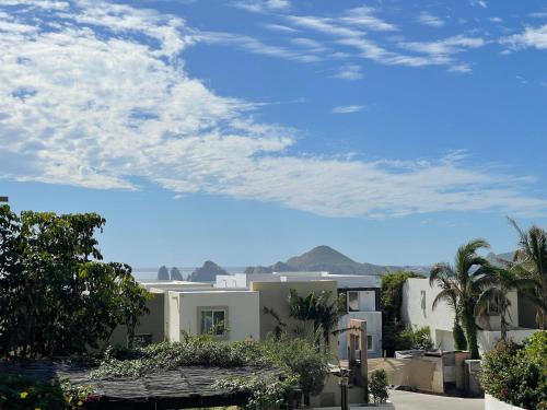 a view of a house with mountains in the background at Sea view, king-size bed, wheelchair access in Cabo San Lucas
