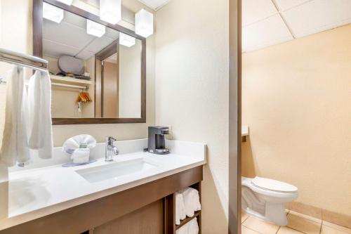 a bathroom with a sink and a toilet at Best Western Corpus Christi in Corpus Christi