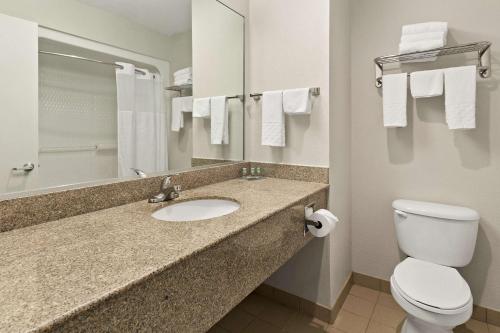 a bathroom with a sink and a toilet at Best Western Galleria Inn & Suites in Houston