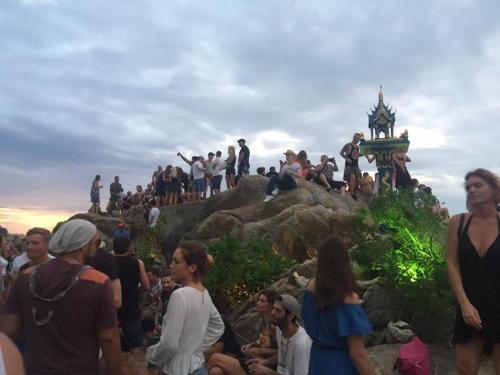 a group of people standing on top of a mountain at Lighthouse Bungalows in Haad Rin