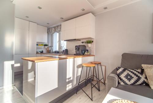 Kuchyň nebo kuchyňský kout v ubytování Bianco Apartament
