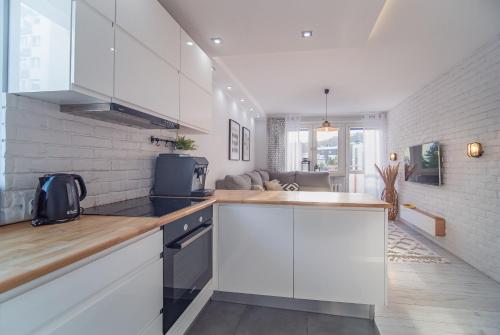 Kuchyň nebo kuchyňský kout v ubytování Bianco Apartament