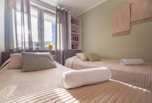 Postel nebo postele na pokoji v ubytování Bianco Apartament