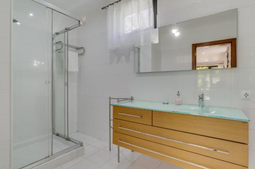 a bathroom with a sink and a shower at Passion Villa in Machico
