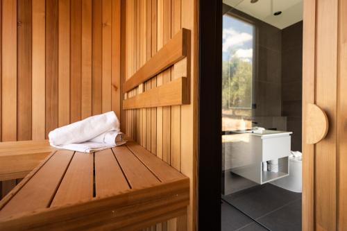 a sauna with a towel sitting on a wooden bench at CABN X Seppeltsfield Barossa in Seppeltsfield