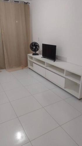 a white room with a desk with a laptop on it at Campina Residence in Campina Grande