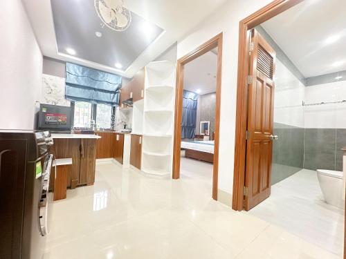 a bathroom with a sink and a toilet in a room at Milanesa Hotel and Apartment in Vung Tau
