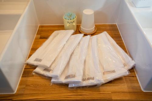 a box filled with plastic bags on top of a wooden floor at のと千里浜リゾート in Hakui