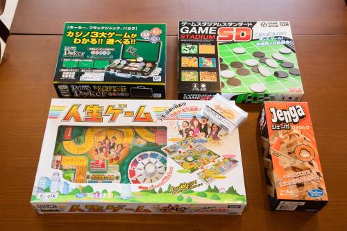 a pile of games on a table at のと千里浜リゾート in Hakui