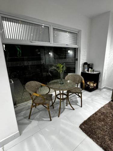 a dining room with a table and chairs and a fireplace at Hotel Zuriel Boutique in Cartagena de Indias