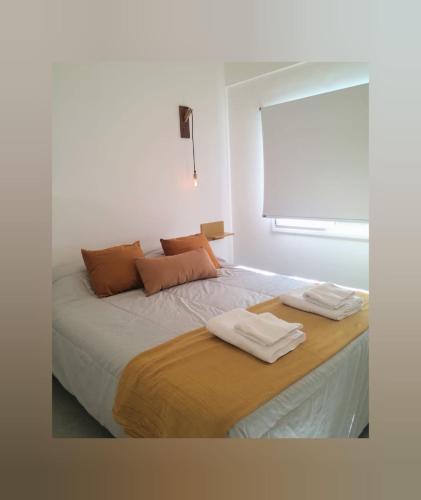 Ένα ή περισσότερα κρεβάτια σε δωμάτιο στο Apart Las Victorias