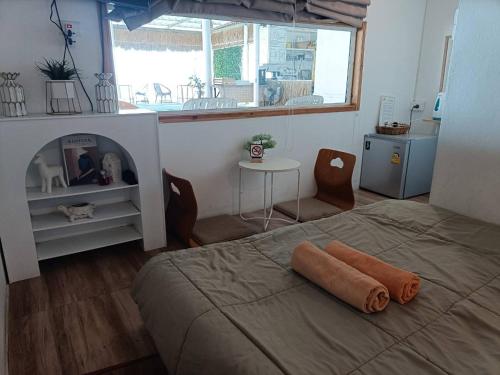 Posteľ alebo postele v izbe v ubytovaní Chuencheewa Resort