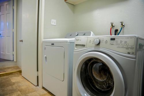 a washer and dryer in a laundry room at Relaxing Home With SF Bay View in Millbrae