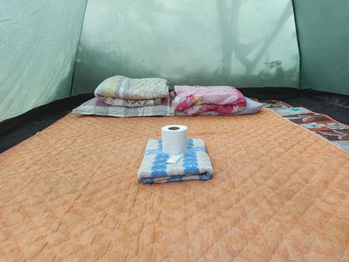 a tent with two beds and a toilet on it at Pai Forest Resort in Pai