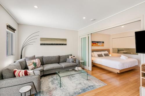 a living room with a couch and a bed at Pool View Apartments - Wing 5 - at Peppers Salt Resort by uHoliday 2BR 1BR and Hotel Room Options Available in Kingscliff