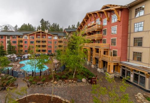 an aerial view of an apartment complex with a pool at Quiet, Updated, Corner Condo in the Village! Parking, Pool & Spa in Mammoth Lakes