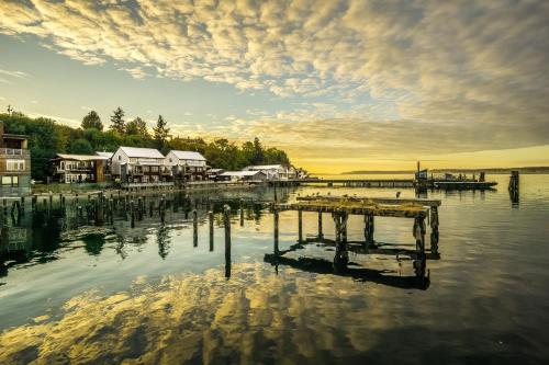 a dock on a body of water with houses and trees at BOATYARRD Inn # 9 in Langley