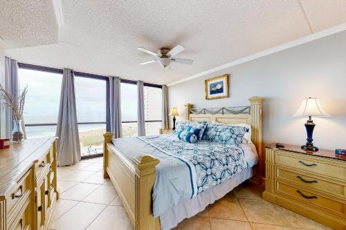 a bedroom with a bed and a large window at Golden Sands 618 in Ocean City