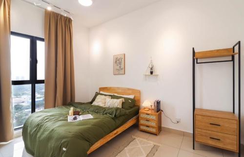 a small bedroom with a bed and a window at 10 min to My town family unit By Nexx Field in Kuala Lumpur