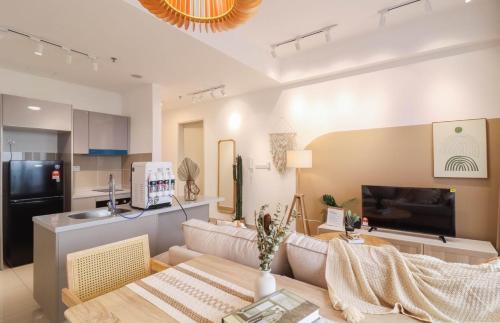 a living room with a couch and a table at 10 min to My town family unit By Nexx Field in Kuala Lumpur