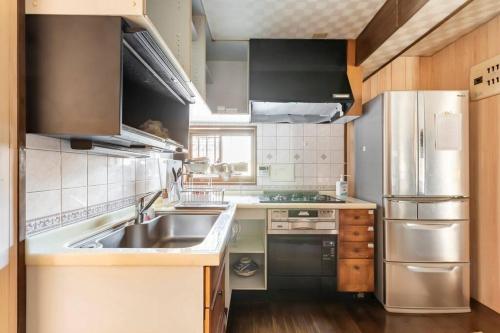 Kuchyň nebo kuchyňský kout v ubytování おさじの宿　堂屋敷