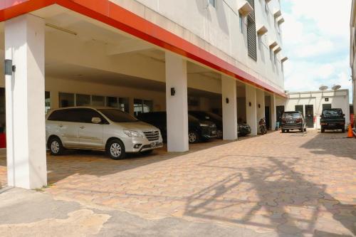 a group of cars parked inside of a building at Cordela Inn R Sukamto Palembang in Palembang