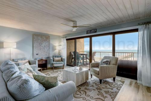 a living room with a couch and chairs at Amelia The Sea - 442 ASea in Fernandina Beach