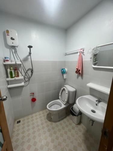a small bathroom with a toilet and a sink at ปางอ่ายแคมป์ปิ้ง in Ban Pang Ai