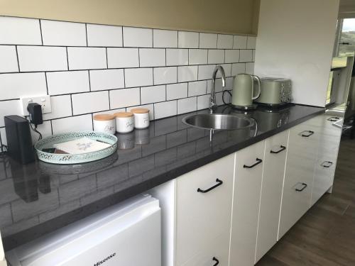 a kitchen with a sink and a counter top at The Yarra Valley Couple Escape in Yarra Glen