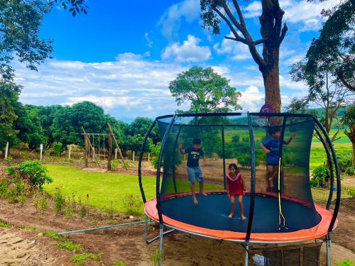 a group of kids playing on a trampoline at ปางอ่ายแคมป์ปิ้ง in Ban Pang Ai