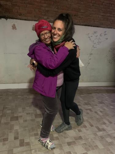 Dos mujeres abrazándose en una habitación en BnB Royal Tourist House, en Katmandú