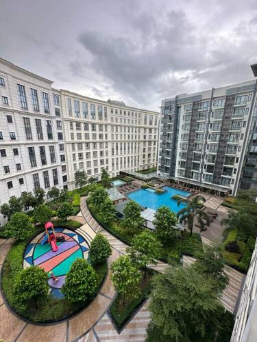 an aerial view of a large apartment complex with two pools at Airport NAIA Terminal 3 Insane Interior in Manila