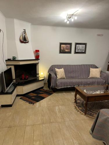 a living room with a couch and a fireplace at Coast Horizon in Romanós